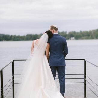 bride and groom from behind looking at lake