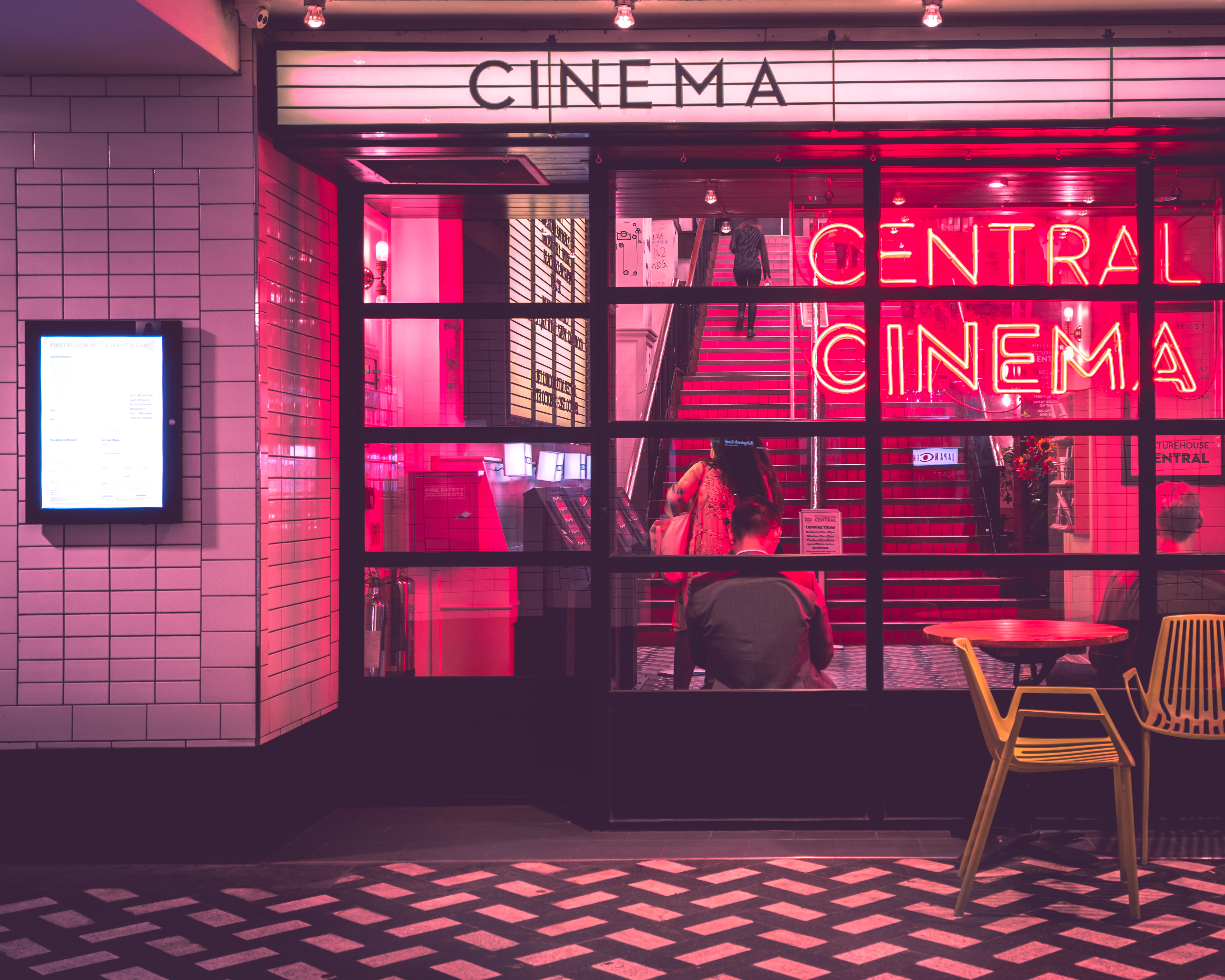 cinema lobby with neon lights in the backgorund